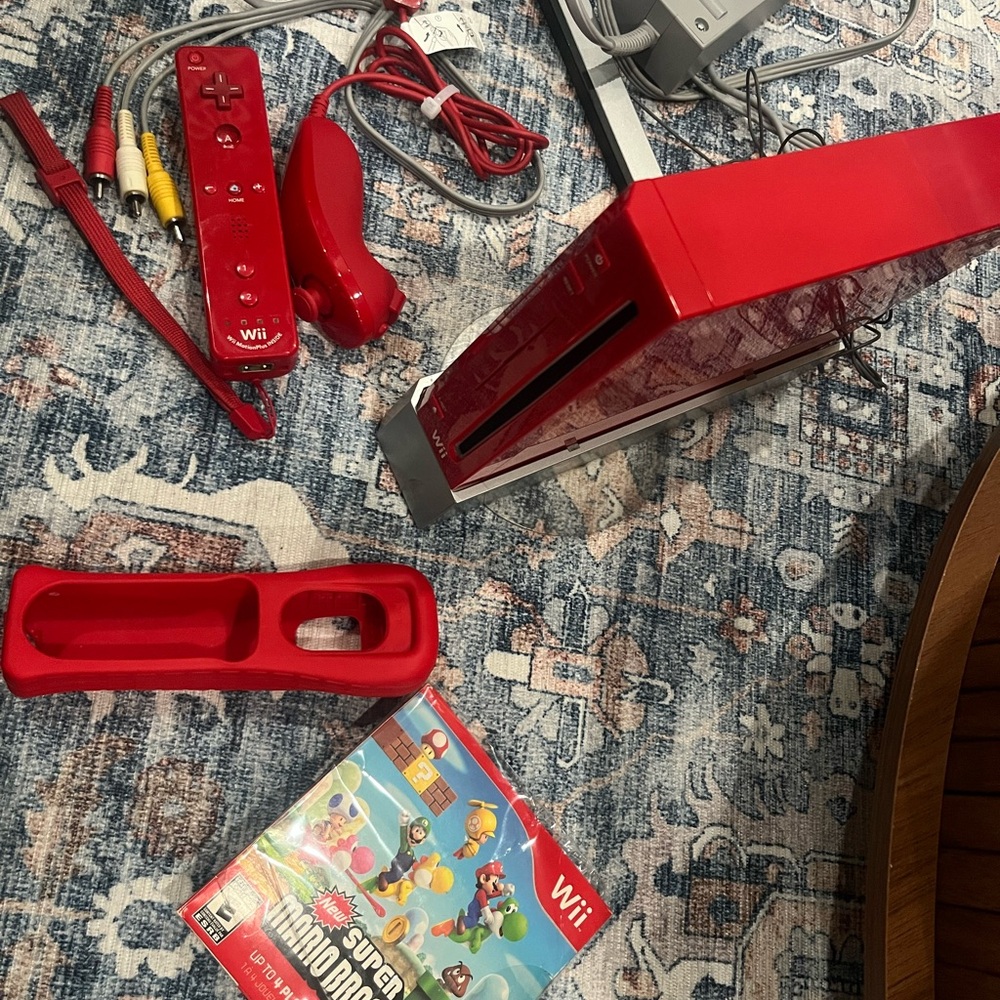 Nintendo Wii in Vibrant Red with Accessories controller. Some times. Works.